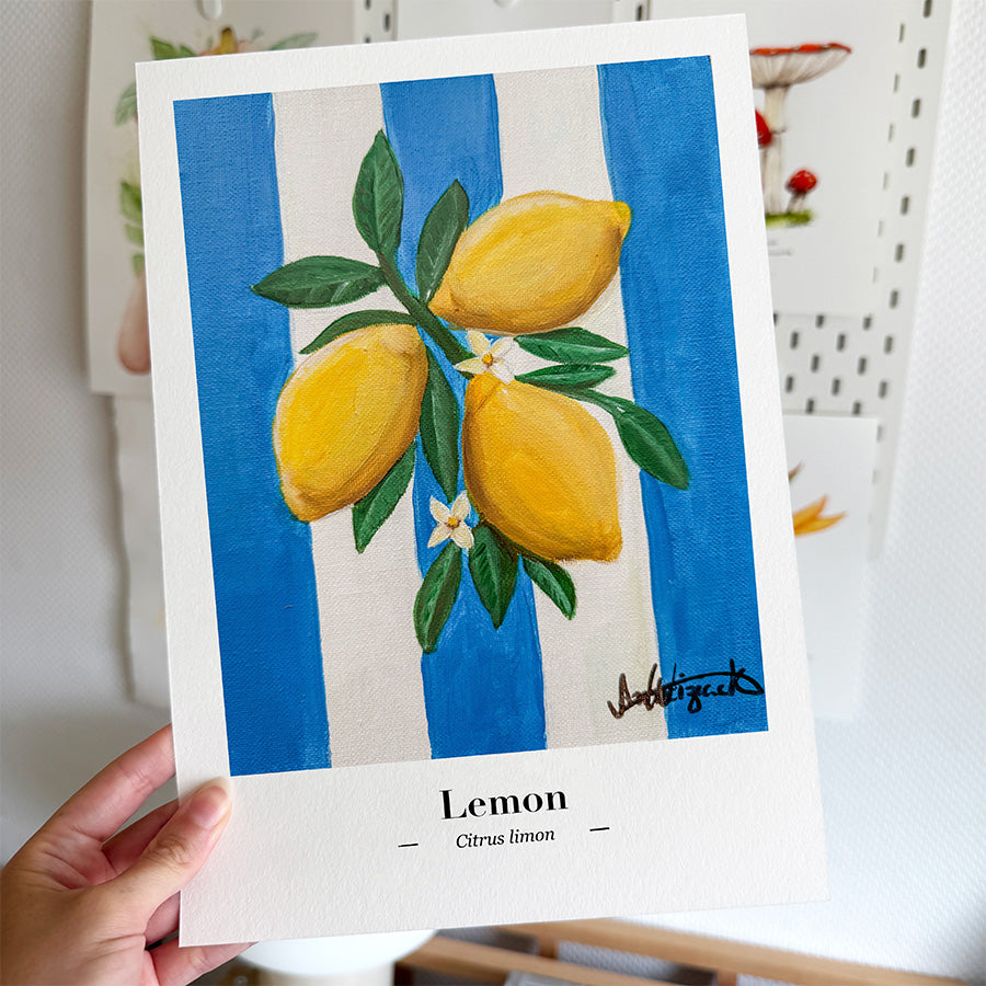 A fine art print featuring an original illustration of a summery lemon against a blue-striped background.