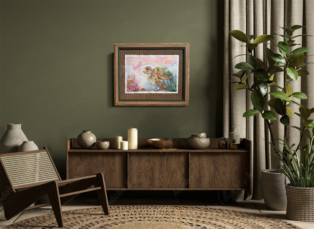 Living room with wooden sideboard, chair, and framed artwork on a green wall.