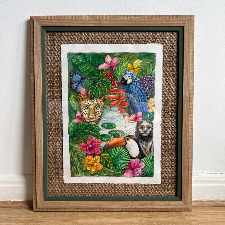 Framed artwork of animals and flowers in a jungle setting