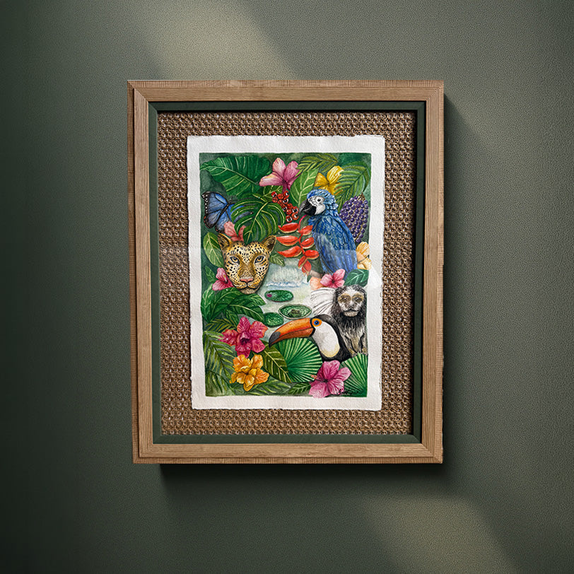 Framed artwork of animals and flowers on a green wall