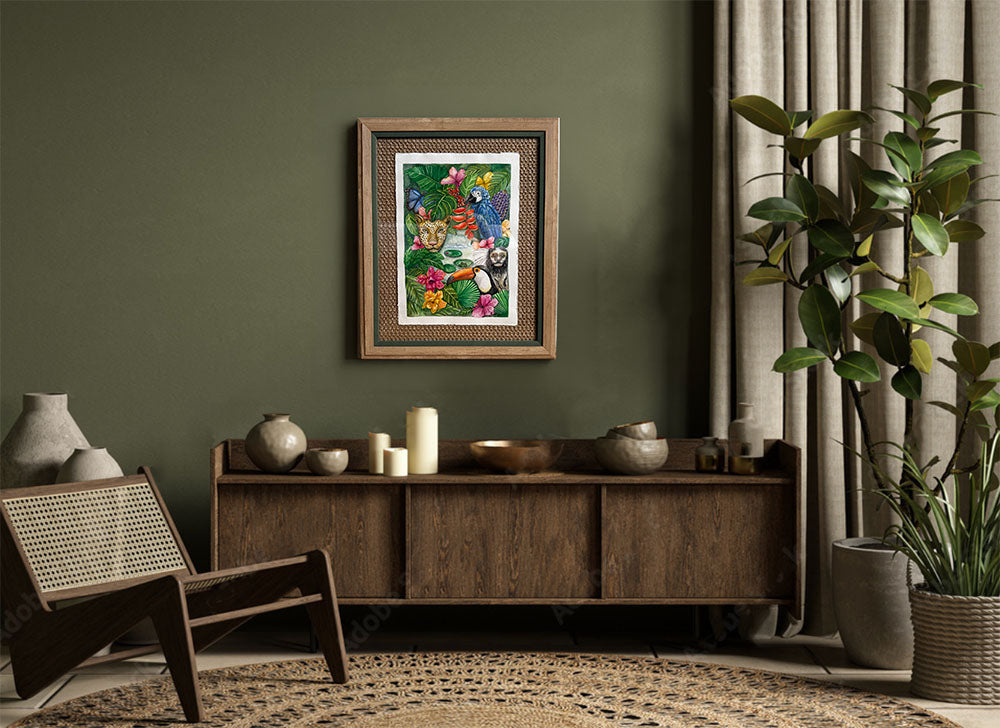 Framed artwork on a wall in a living room with a wooden cabinet and decorative items.