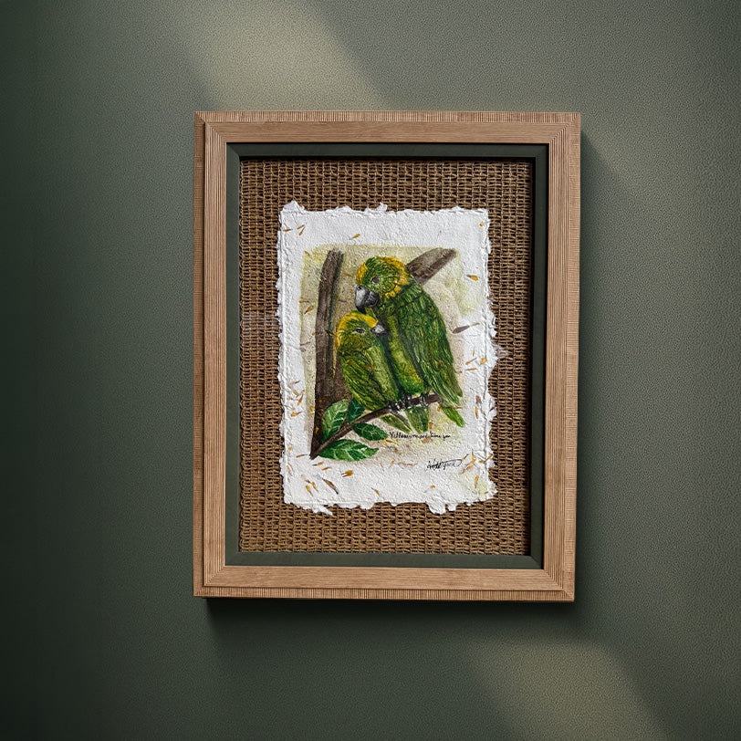 Framed artwork of a parrot on a branch with a textured background