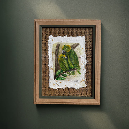 Framed artwork of a parrot on a branch with a textured background